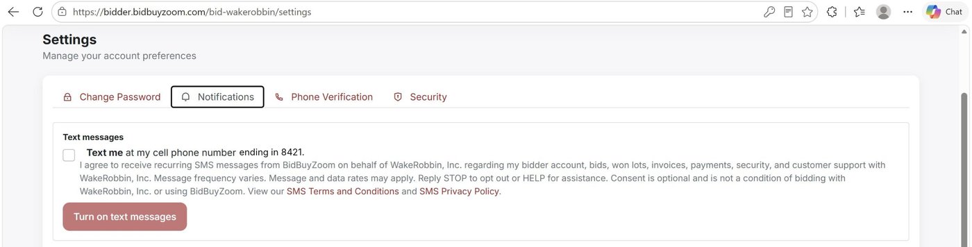 BidBuyZoom account Settings on an auction company’s site, Text messages section, showing the optional consent checkbox naming that auction company, unchecked by default, and the Turn on text messages button